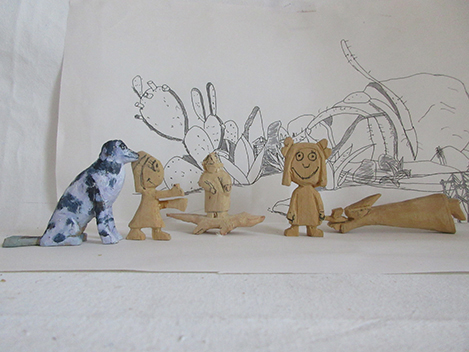 Woodcarvings with desert drawings